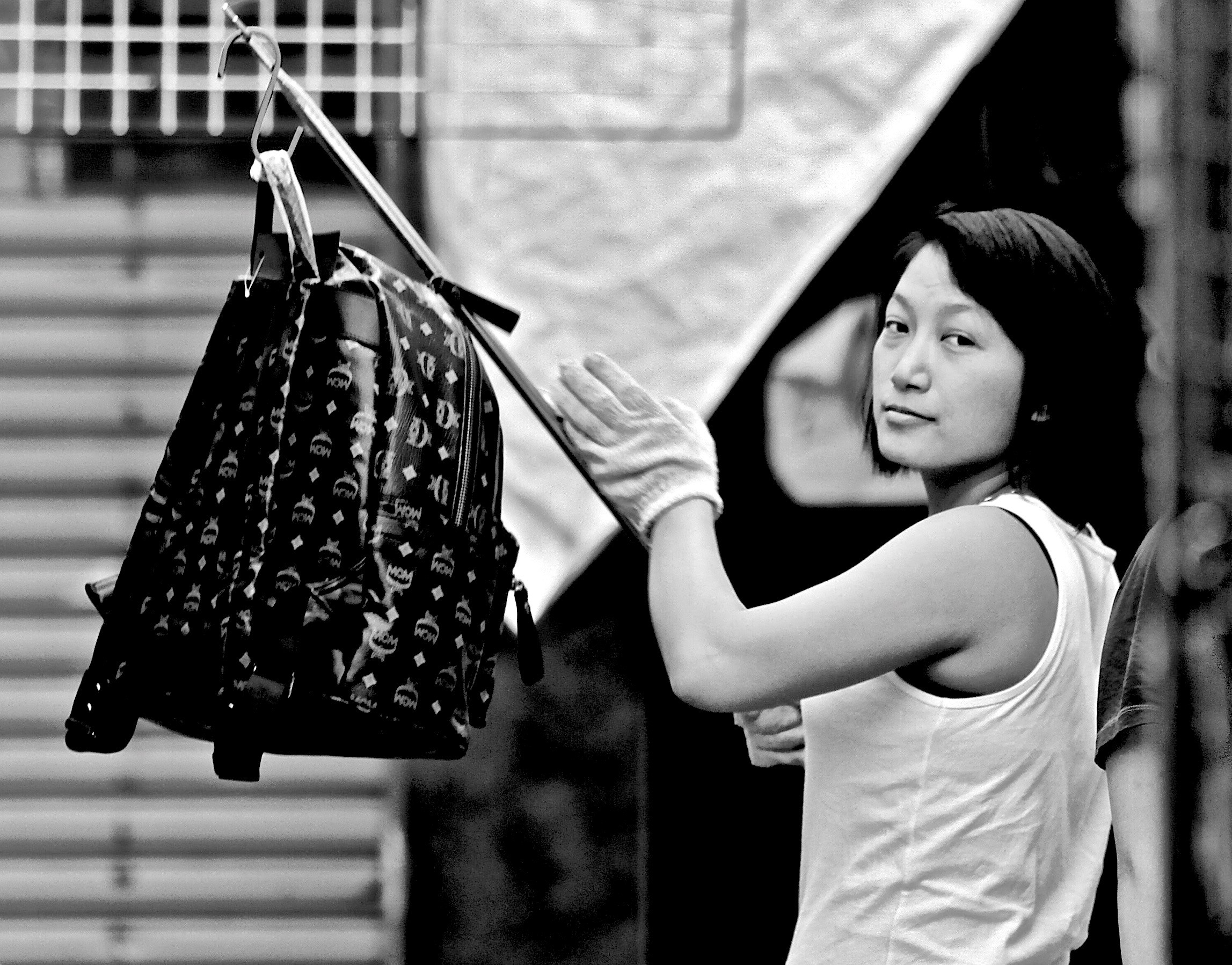 Market vendor preparing to open. Mong Kok, Hong Kong, 2014